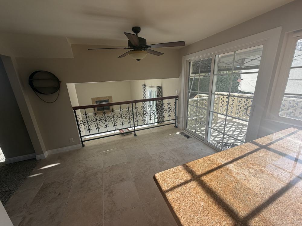 The same family room empty after our team removed the furniture